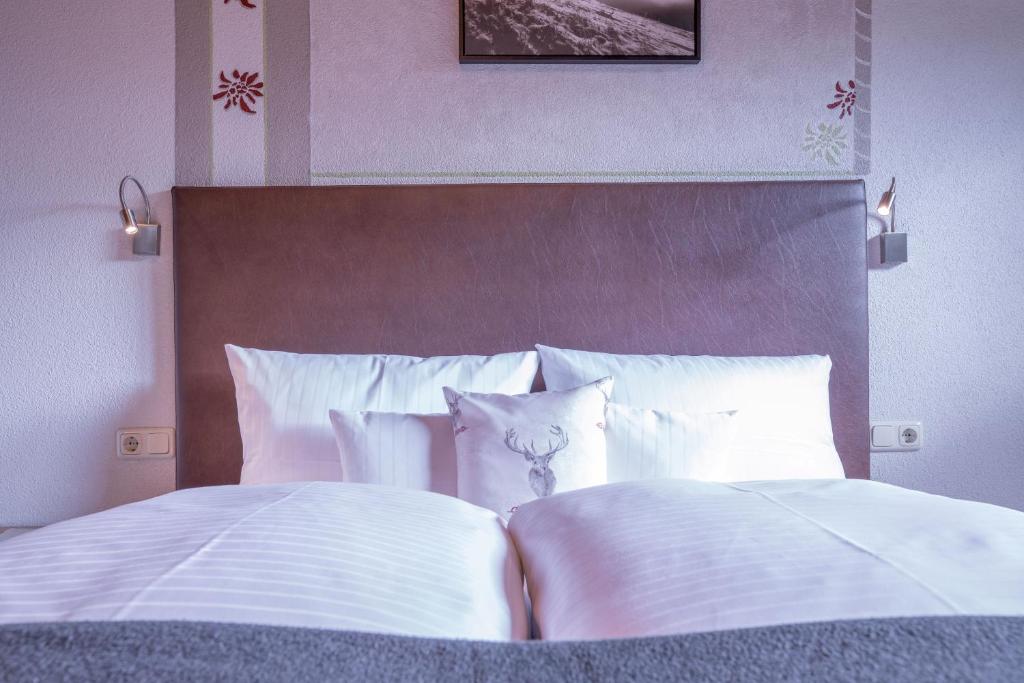 Postel nebo postele na pokoji v ubytování Patteriol Apart-Hotel-Garni