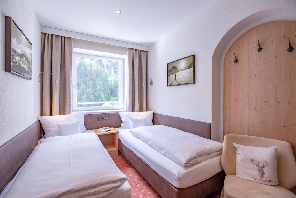 Postel nebo postele na pokoji v ubytování Patteriol Apart-Hotel-Garni