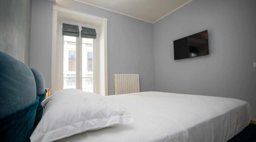Postel nebo postele na pokoji v ubytování Palazzo Brienza