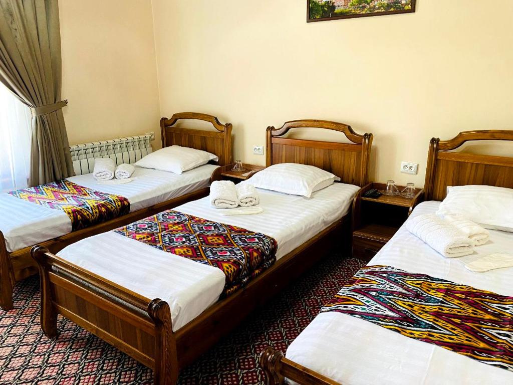 Ένα ή περισσότερα κρεβάτια σε δωμάτιο στο Elegant Family Hotel