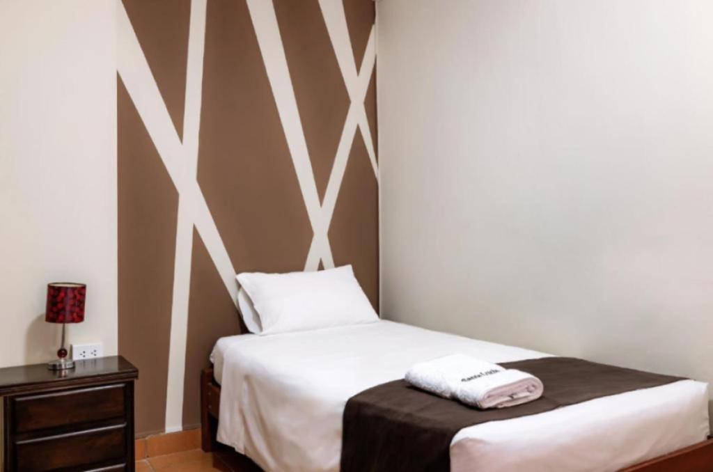 Postel nebo postele na pokoji v ubytování Hotel Santa Lucia - Oficial