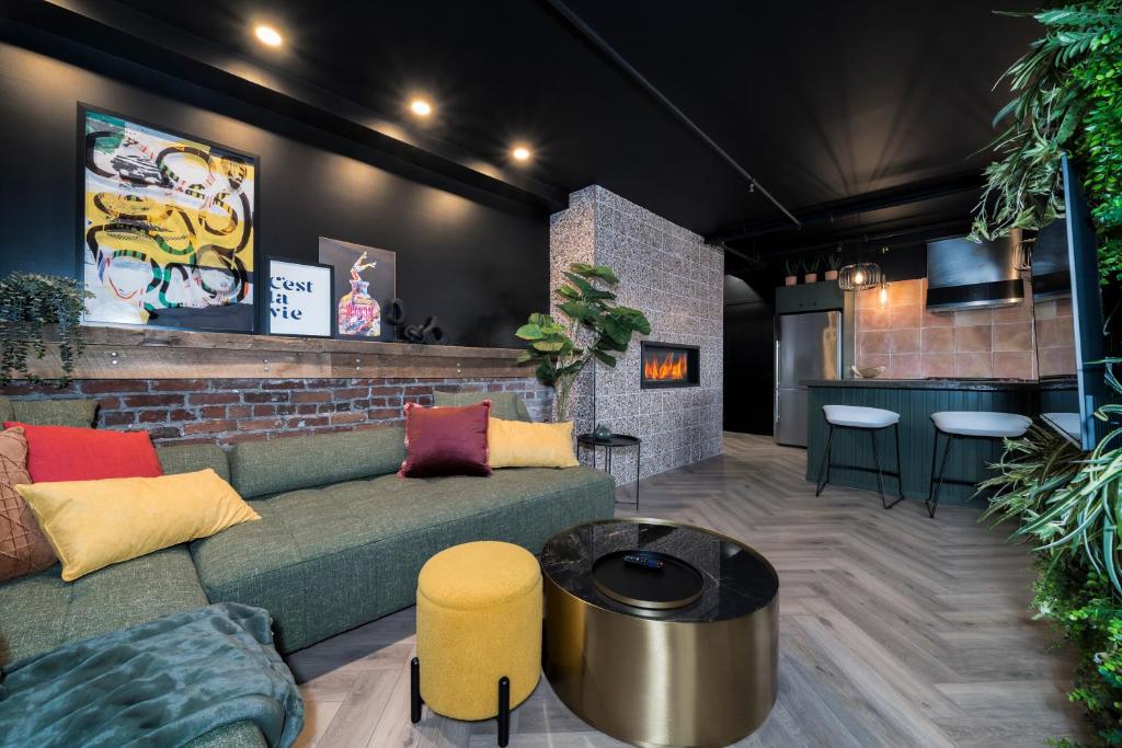 a living room with a couch and a bar at Heaven's Garden / / Luxury penthouse downtown in Quebec City