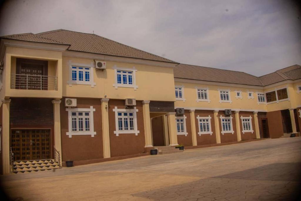 a large building with a lot of windows at Ritz & Gold Hotel & Suites, Makurdi in Makurdu