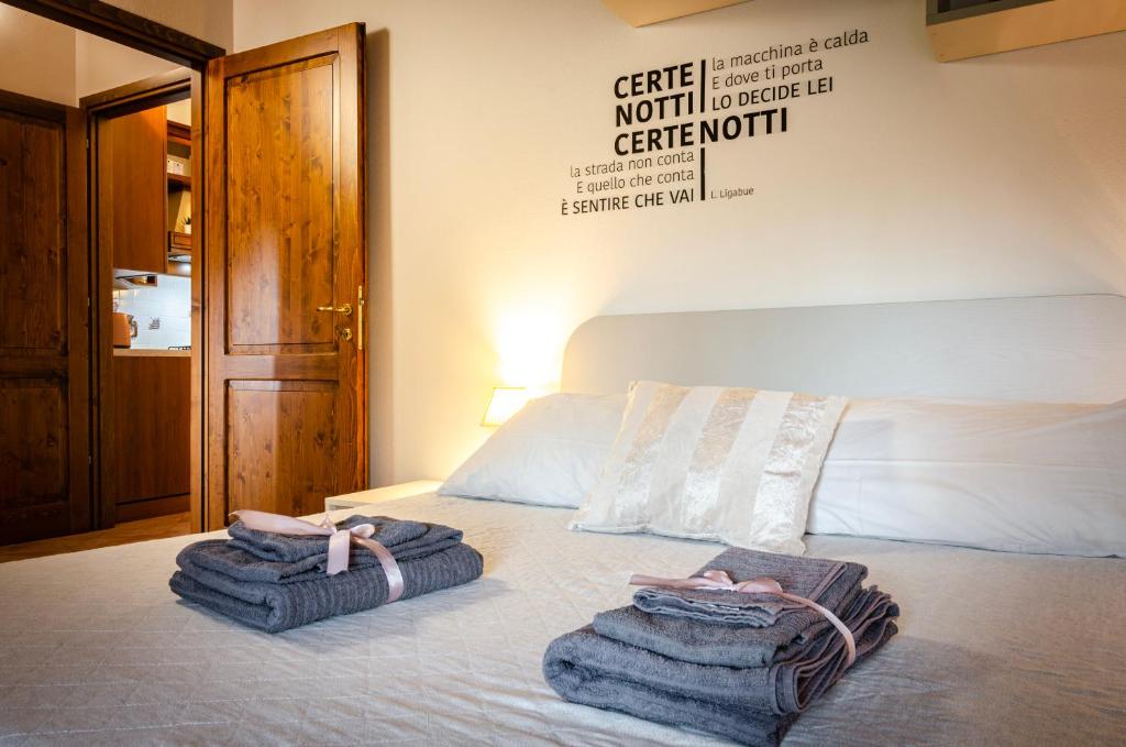 Łóżko lub łóżka w pokoju w obiekcie Casa Quarto di Luna