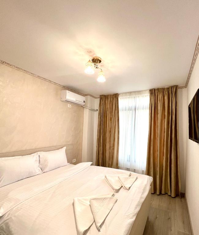 Postel nebo postele na pokoji v ubytování Hotel Marina 2