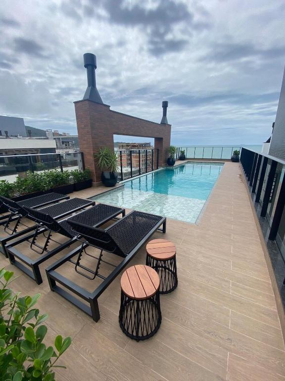 a balcony with a swimming pool on top of a building at Apart Villa Francione in Bombas
