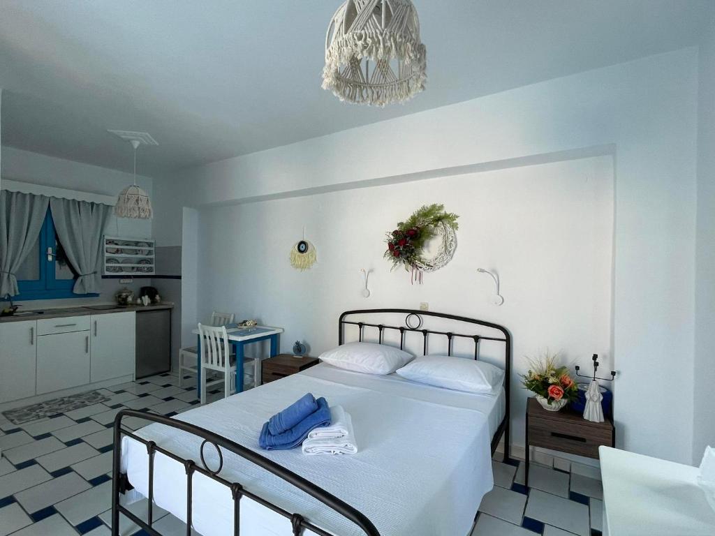 Postel nebo postele na pokoji v ubytování GIAVASI SEASIDE FINIKI