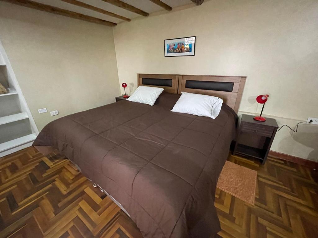 Postel nebo postele na pokoji v ubytování Anka Wasi Lodging