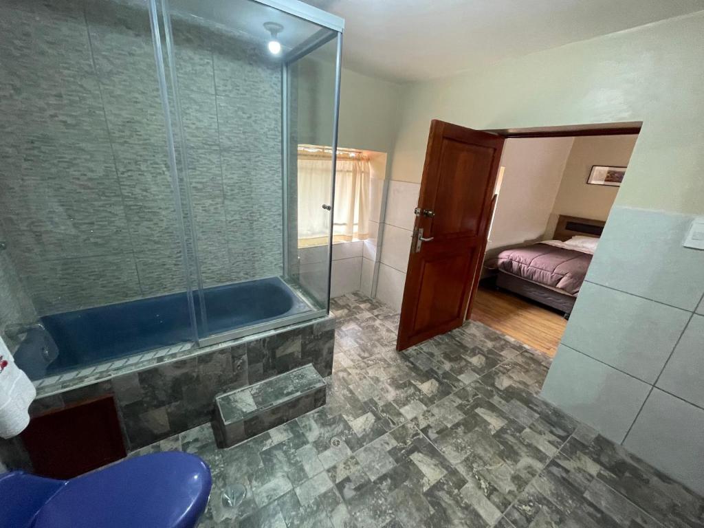 Postel nebo postele na pokoji v ubytování Anka Wasi Lodging