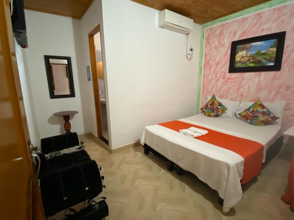 Postel nebo postele na pokoji v ubytování Hotel imperial