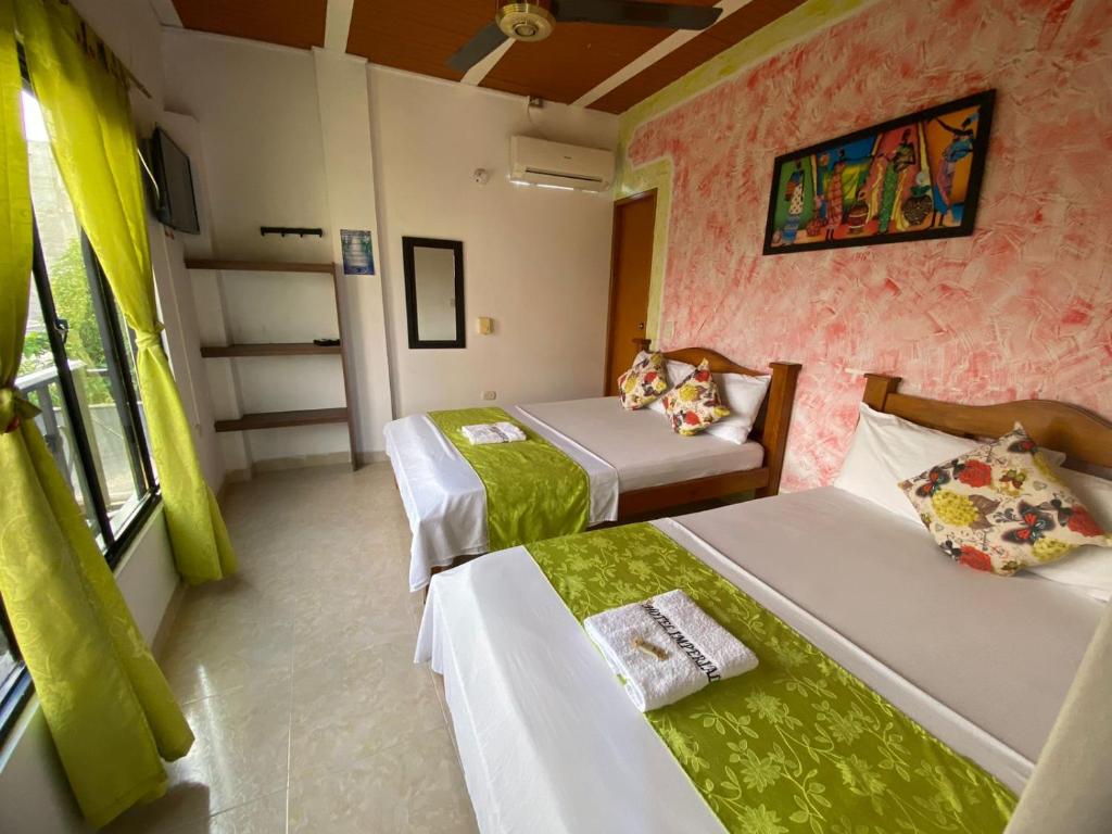 Postel nebo postele na pokoji v ubytování Hotel imperial
