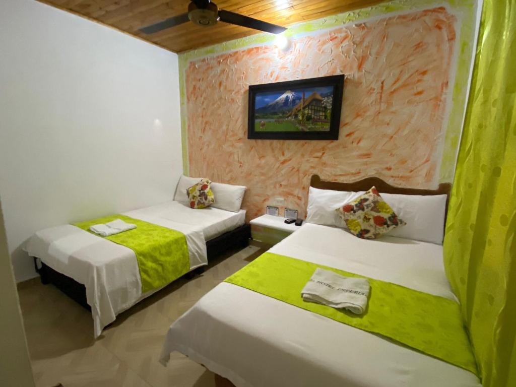Postel nebo postele na pokoji v ubytování Hotel imperial