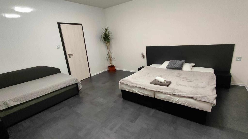 Postel nebo postele na pokoji v ubytování Apartmány u golfu