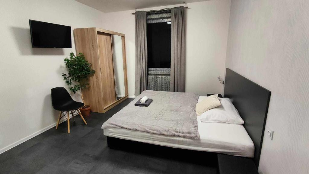 Postel nebo postele na pokoji v ubytování Apartmány u golfu