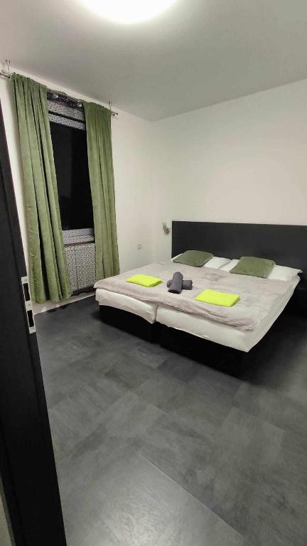 Postel nebo postele na pokoji v ubytování Apartmány u golfu