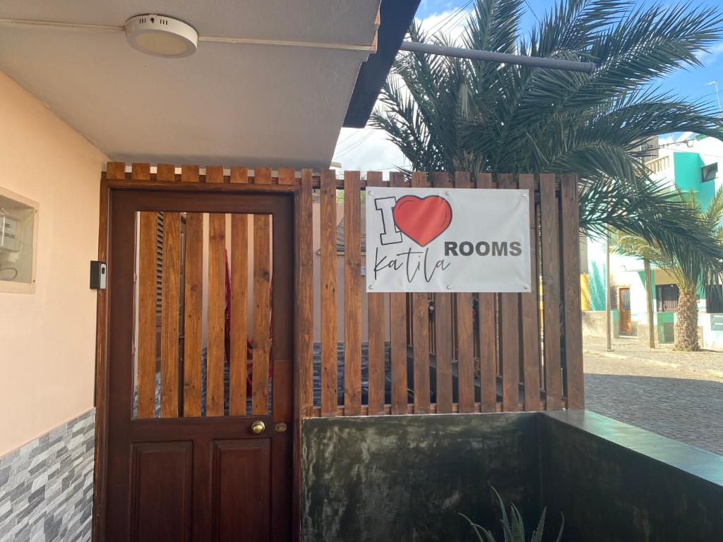a door to a room with a sign on it at Katila-Rooms in Santa Maria