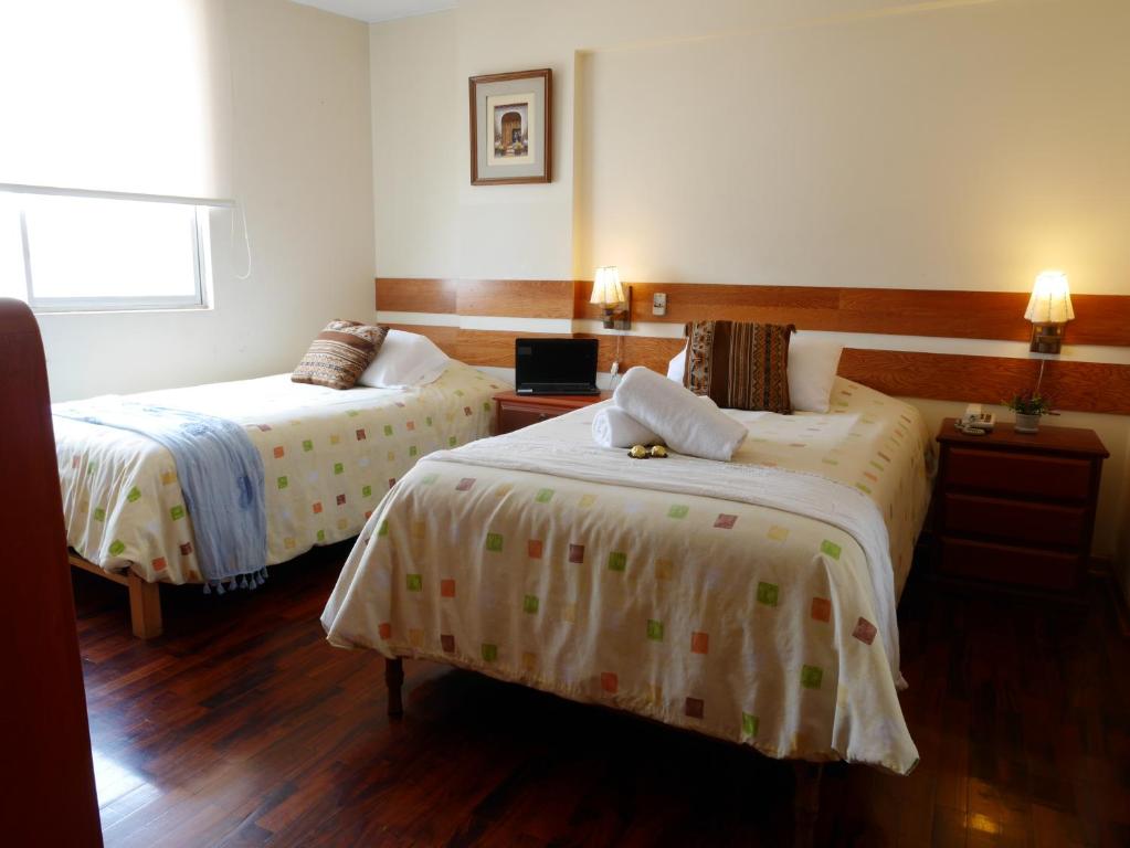 Postel nebo postele na pokoji v ubytování Suite Service Apart Hotel