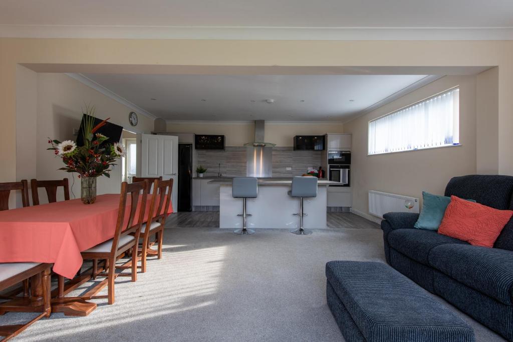 a living room with a table and a couch at Seaview Cottage in Cardiff