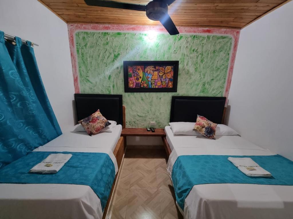 Postel nebo postele na pokoji v ubytování Hotel imperial