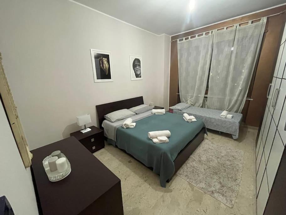 Postel nebo postele na pokoji v ubytování Casa intera Torino - Museo Egizio - Stadio - Pala Alpitour - Via Gravere 20