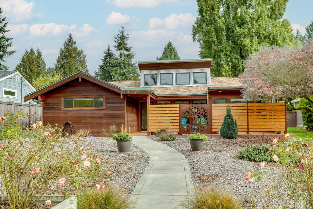 a wooden house with a garden in front of it at Beautiful Seattle Home with Patio about 9 Mi to Downtown in Seattle