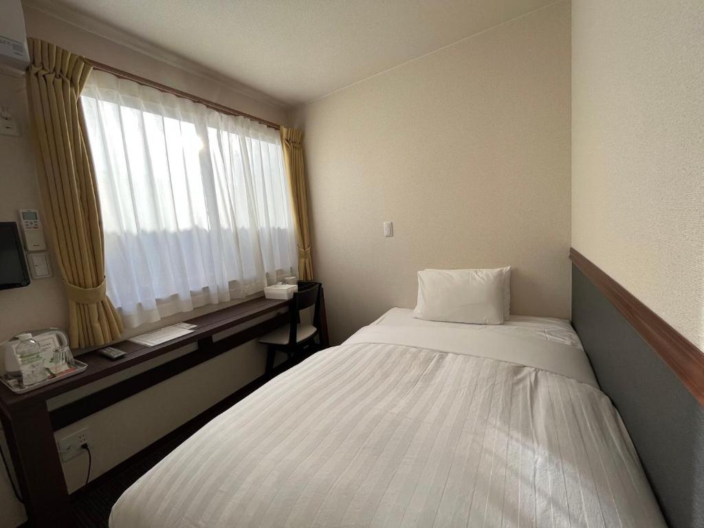 Postel nebo postele na pokoji v ubytování Karin doo Hotel