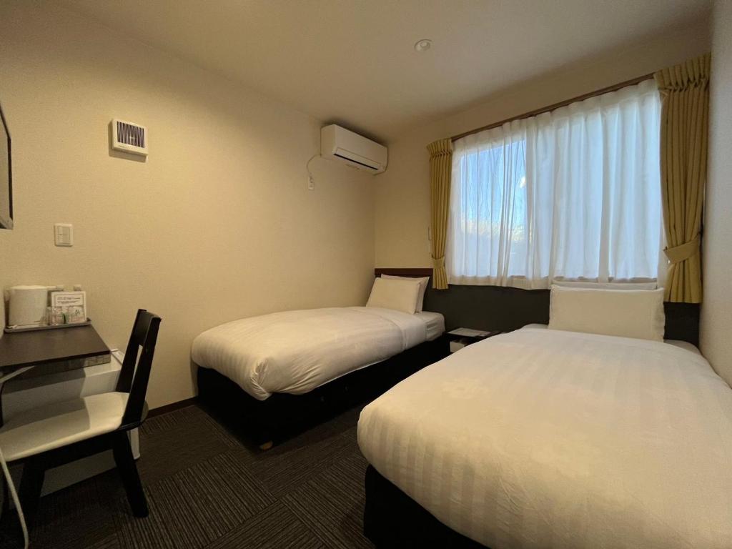 Postel nebo postele na pokoji v ubytování Karin doo Hotel