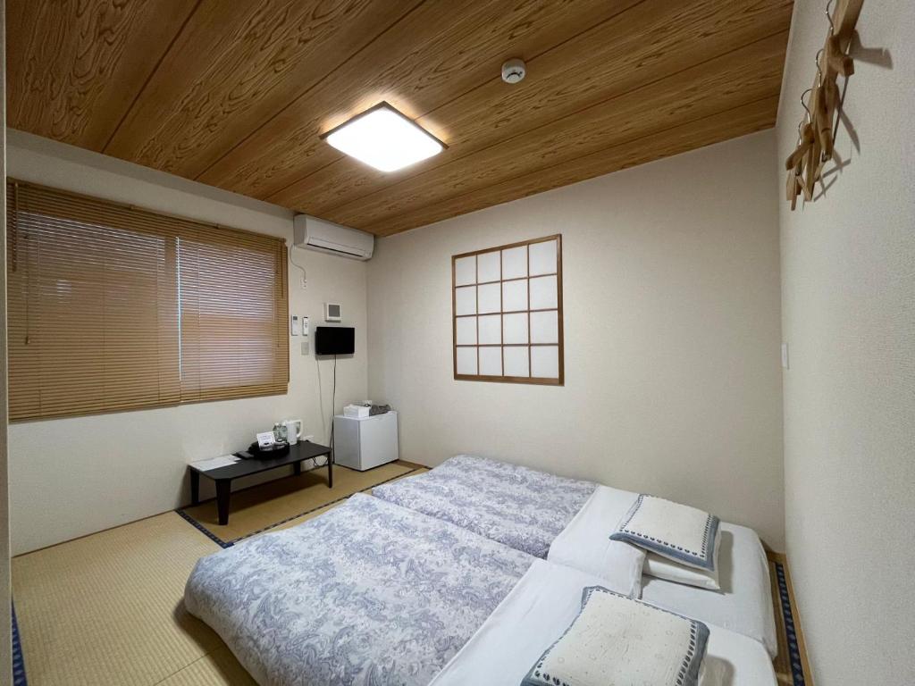 Postel nebo postele na pokoji v ubytování Karin doo Hotel