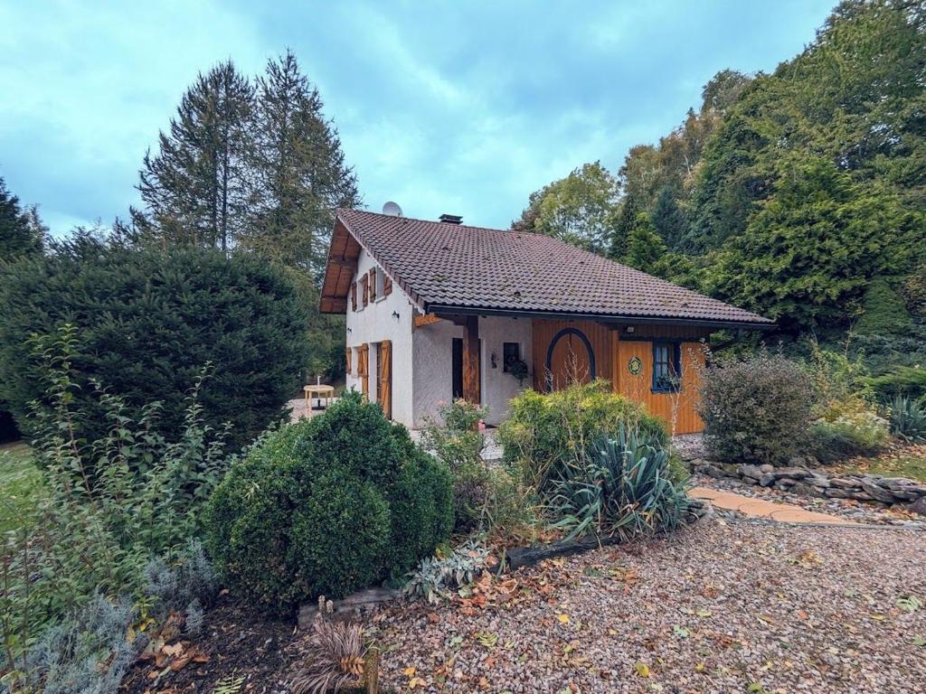 a small house in the middle of a garden at Gîte Anould, 4 pièces, 6 personnes - FR-1-589-2 in Anould