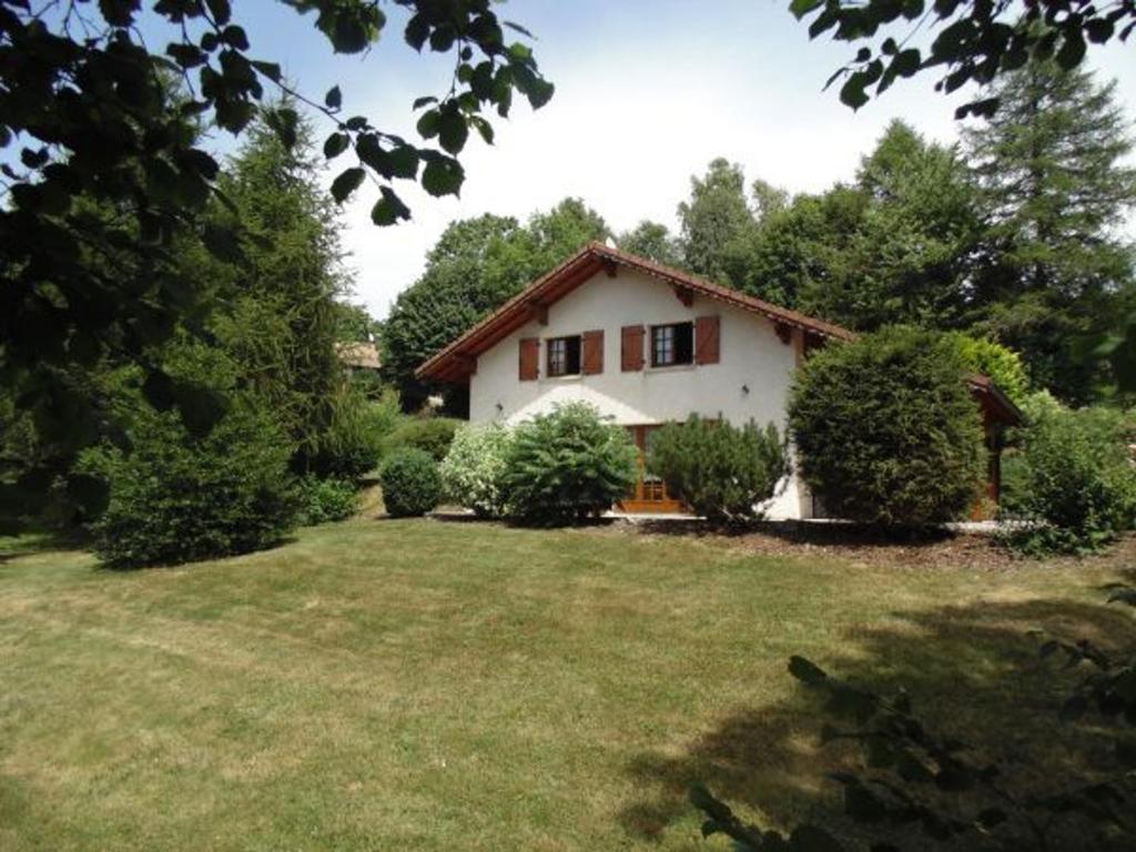 a white house with a yard with bushes and trees at Gîte Anould, 4 pièces, 6 personnes - FR-1-589-2 in Anould