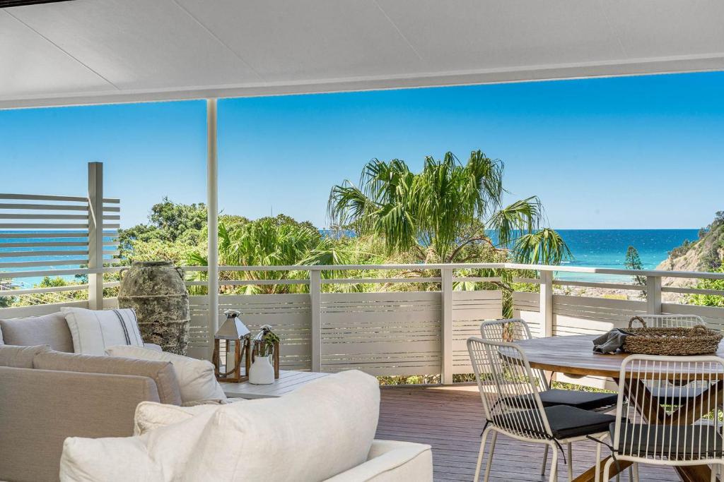 a living room with a view of the ocean at A Perfect Stay - Boardroom at Wategos in Byron Bay