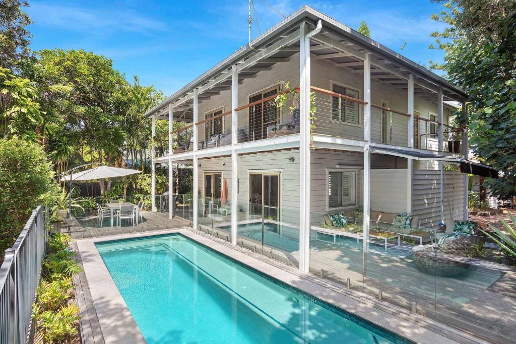 an exterior view of a house with a swimming pool at A Perfect Stay - Pompano House Byron Bay in Suffolk Park