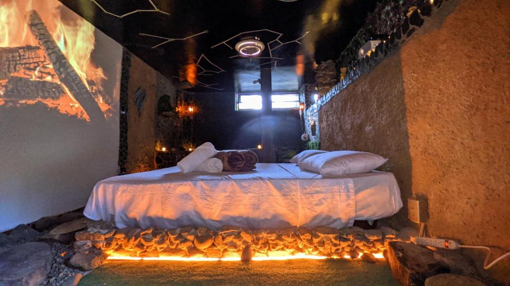 Postel nebo postele na pokoji v ubytování BioHotel Ecohouse