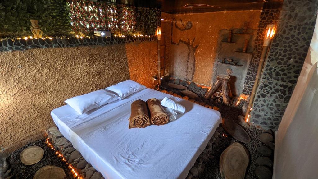 Postel nebo postele na pokoji v ubytování BioHotel Ecohouse