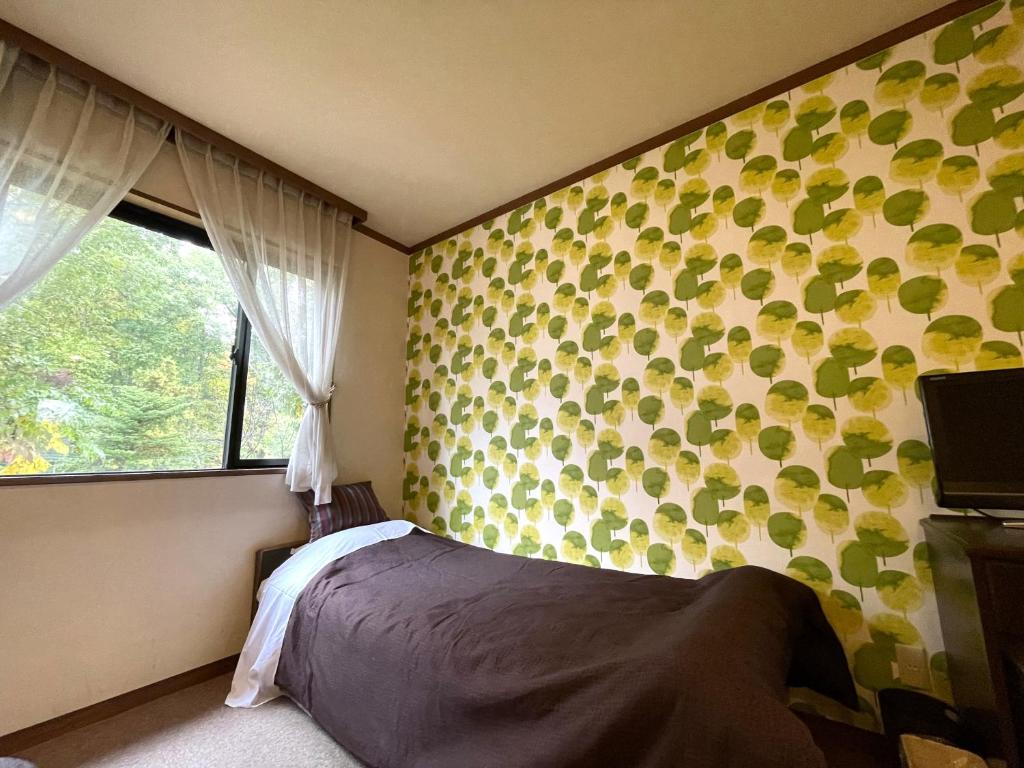 Postel nebo postele na pokoji v ubytování Heidihof Hotel