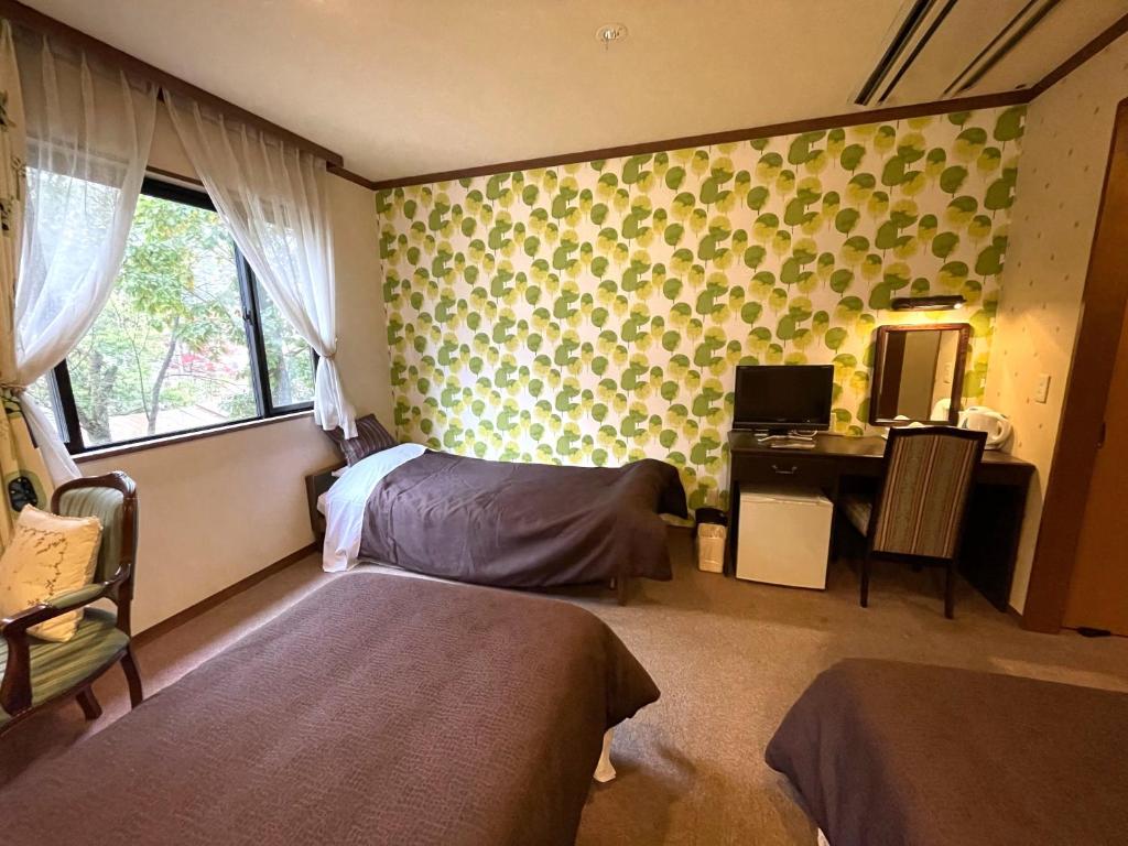Postel nebo postele na pokoji v ubytování Heidihof Hotel
