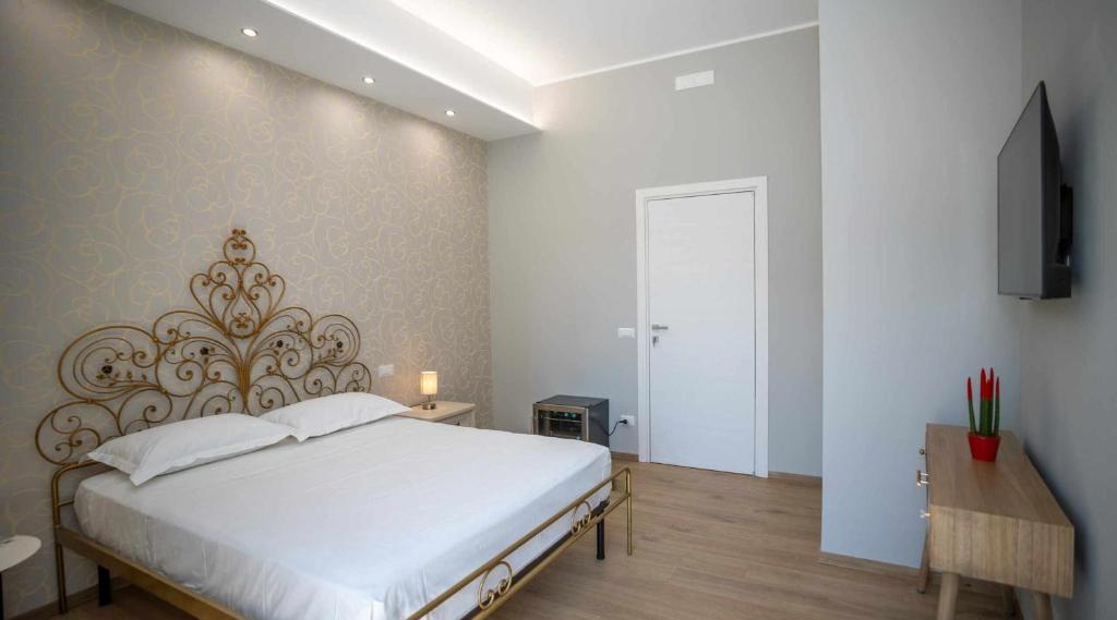 Postel nebo postele na pokoji v ubytování Palazzo Brienza