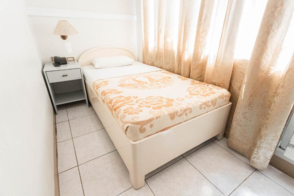 Voodi või voodid majutusasutuse Hotel Canelsa toas