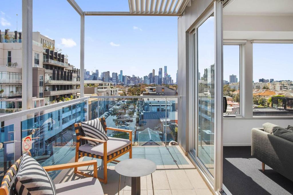 an apartment balcony with a view of the city at Boutique Stays - Zinc Views 501 in Melbourne