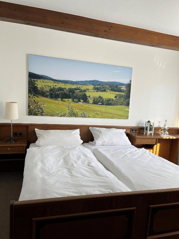 Postel nebo postele na pokoji v ubytování Hotel Schnepper