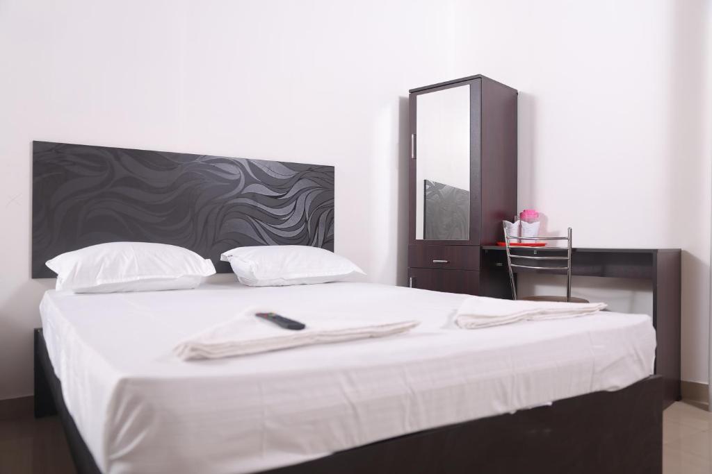 Postel nebo postele na pokoji v ubytování ACE SUITES