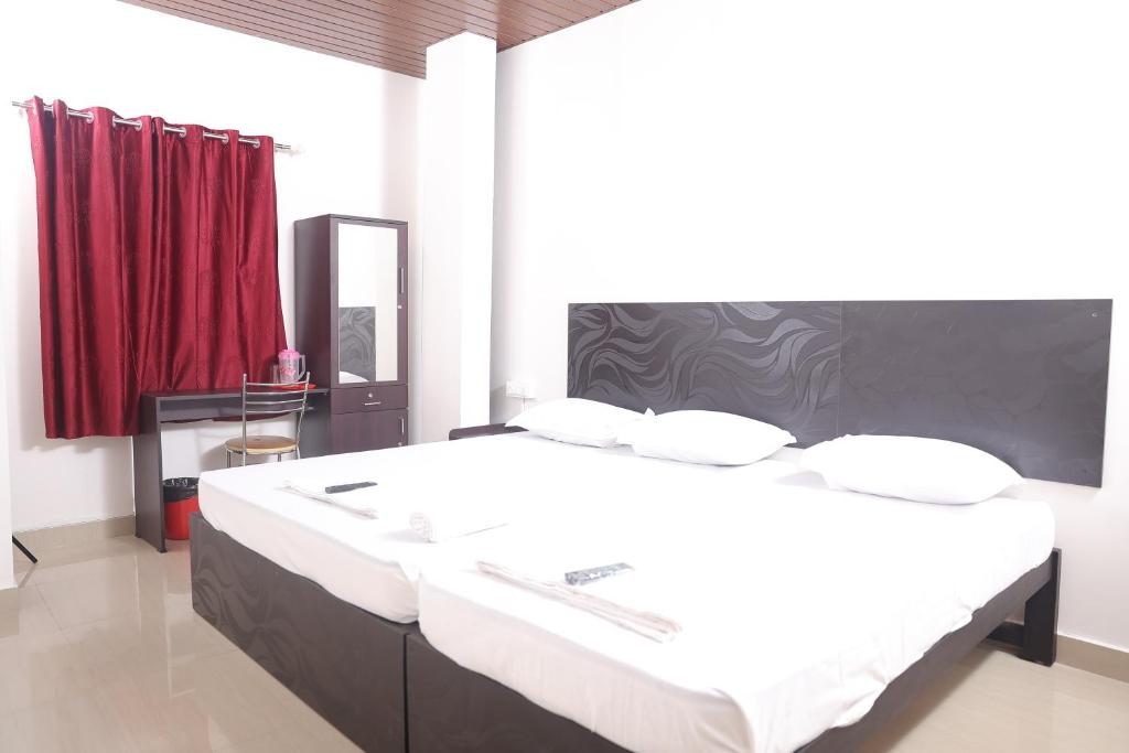 Postel nebo postele na pokoji v ubytování ACE SUITES