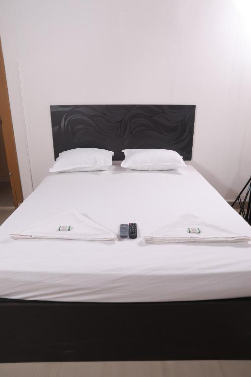 Postel nebo postele na pokoji v ubytování ACE SUITES