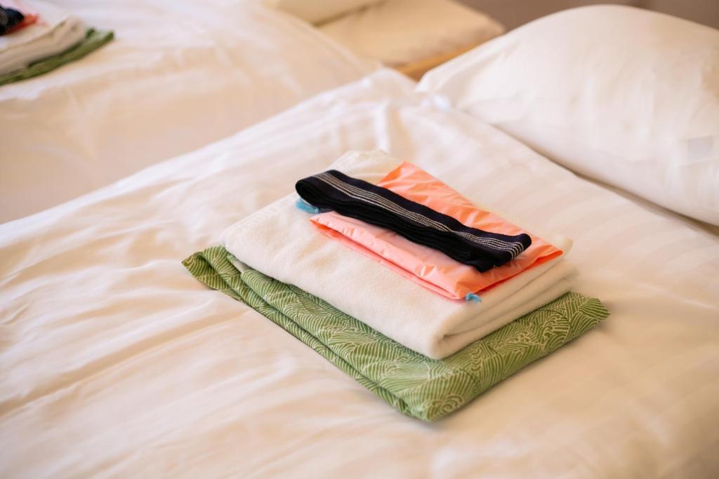 Letto o letti in una camera di glampark Healthy Pal Gunma