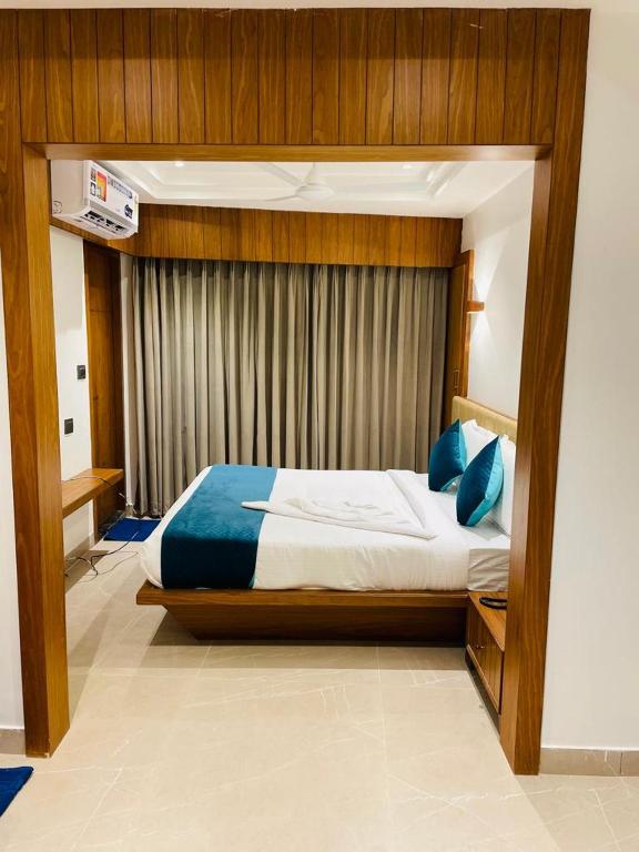 Postel nebo postele na pokoji v ubytování Hotel Emora Tree