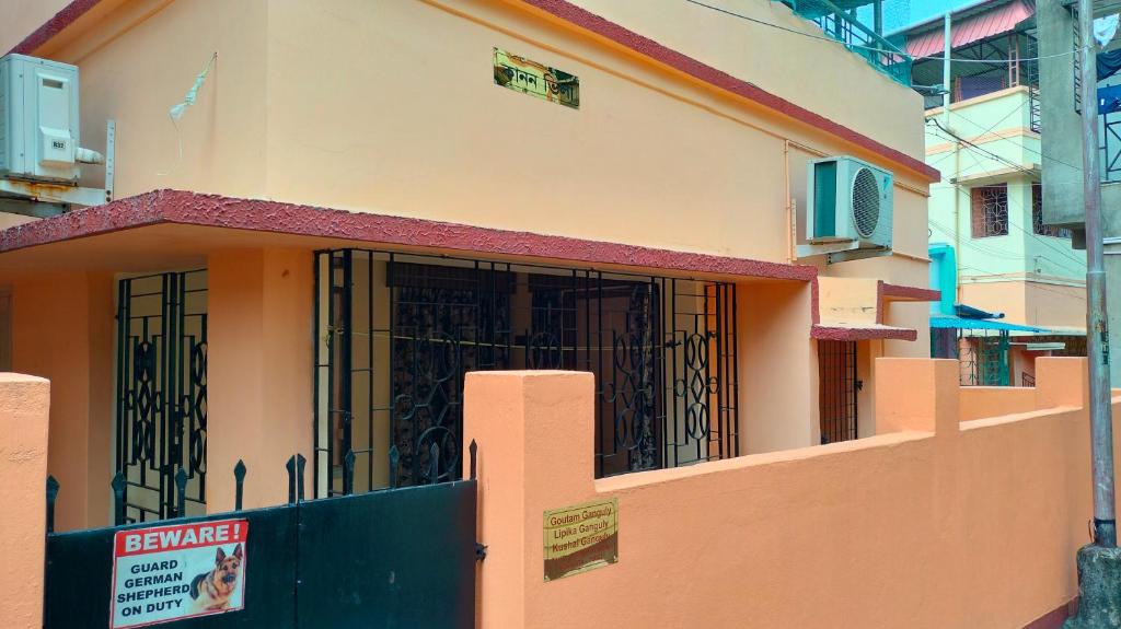 a building with a gate in front of it at Kanan Villa in Kolkata