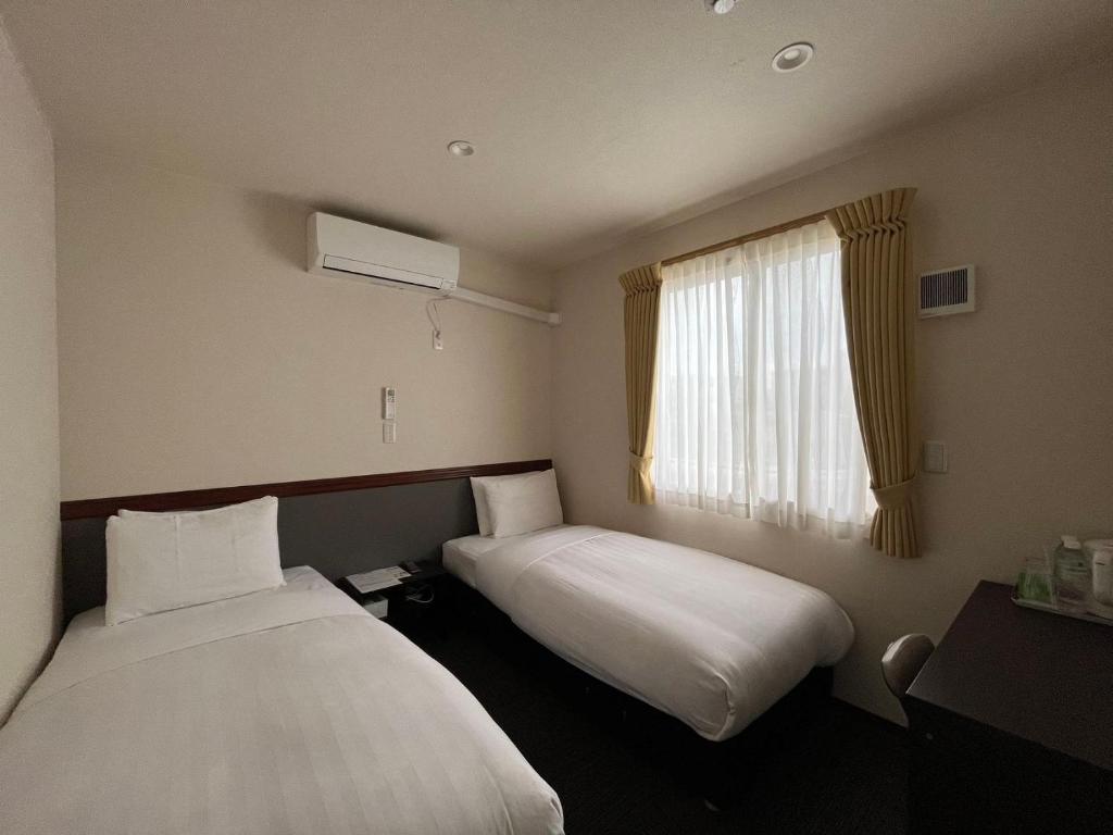 Postel nebo postele na pokoji v ubytování Karin doo Hotel