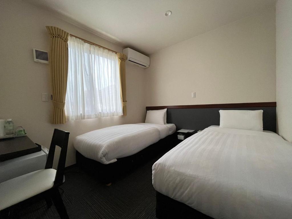 Postel nebo postele na pokoji v ubytování Karin doo Hotel