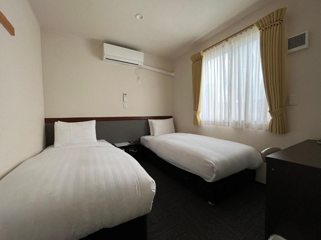 Postel nebo postele na pokoji v ubytování Karin doo Hotel