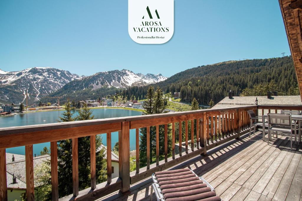 a balcony with a view of a lake and mountains at Sans Souci OG in Arosa
